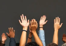 Human Rights Day: Celebrating Equality and Dignity for All Hands of diverse people raised together, symbolizing equality and unity.