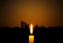 Remembering the Mumbai Terror Attack 26/11: A Tribute to the Victims and Heroes Tribute to Mumbai Terror Attack 26-11 victims, memorial candle and Mumbai skyline.