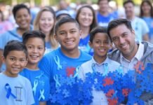 Autism Awareness Month April 2025 A group of people wearing blue shirts to celebrate Autism Awareness Month