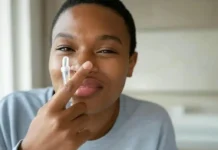 National Wash Your Nose Day: A Fun Way to Improve Your Health and Hygiene A person gently washing their nose using a nasal irrigation device - National Wash Your Nose Day