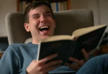 Reading Is Funny Day: Celebrate Humor Through Books and Stories A person laughing while reading a funny book to celebrate Reading Is Funny Day