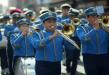 Marching Music Day (March 4th) Marching Music Day - a marching band performing during a parade, with musicians dressed in uniforms, playing brass instruments