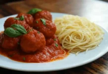 National Meatball Day: Celebrating the Irresistible Delight of Meatballs Plate of meatballs served with spaghetti and marinara sauce