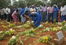 International Day of Reflection on the 1994 Genocide Against the Tutsi in Rwanda people paying their respects at the mass graves, commemorating the lives lost during the 1994 genocide.