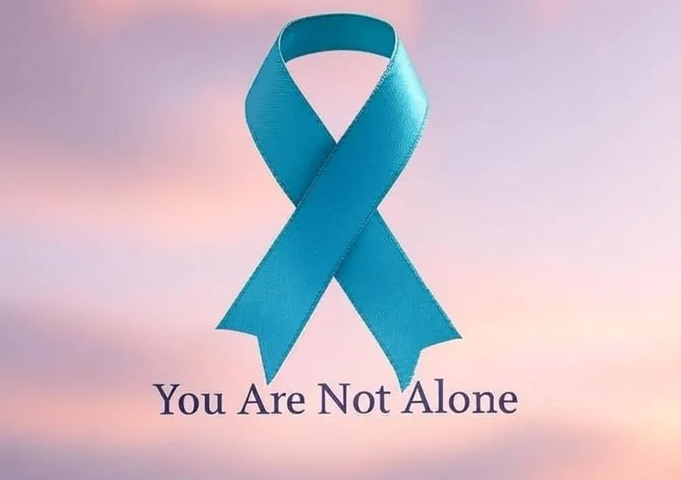 Teal and purple ribbon symbolizing National Suicide Prevention Month Teal and purple ribbon symbolizing National Suicide Prevention Month